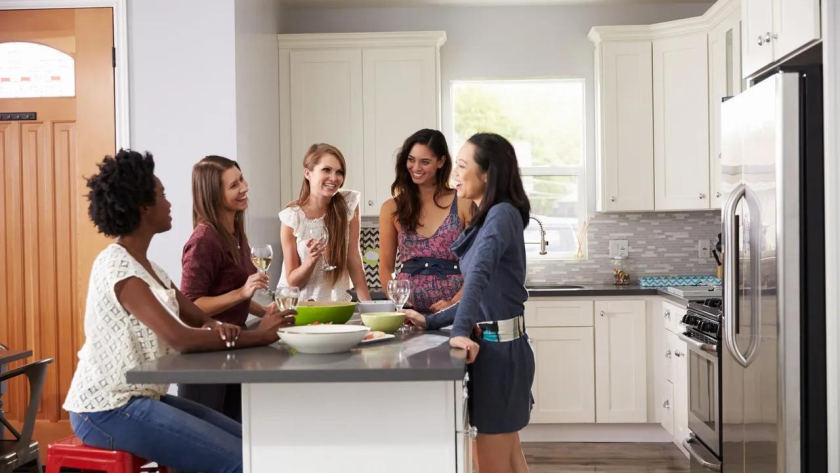 Friends around kitchen island