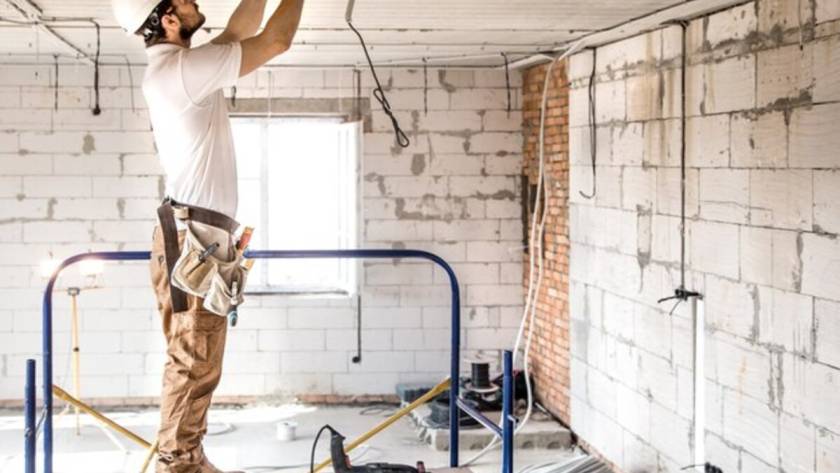 An electrician working during a home remodel